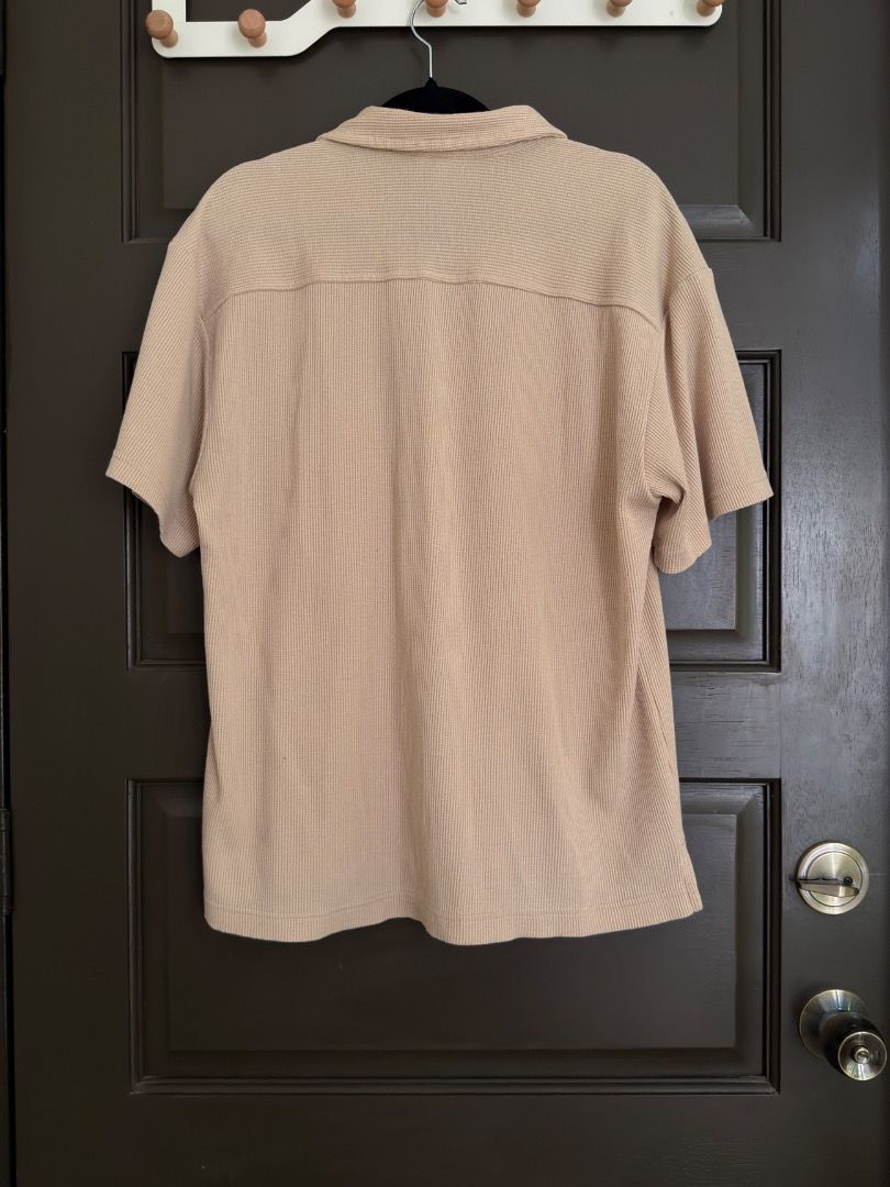 Beige Textured Short Sleeve Button Down Shirt (Category: Tshirts & Polo Shirts ) located in Calamba. Submitted by prongsiepoo (Listing ID 1469080421, Image 2). Description: - Color: Versatile beige - Material: Textured waffle fabric - Design: Camp collar, front button closure, and single chest pocket - Fit: Relaxed fit for daily comfort - Condition: Clean and ready to wear.