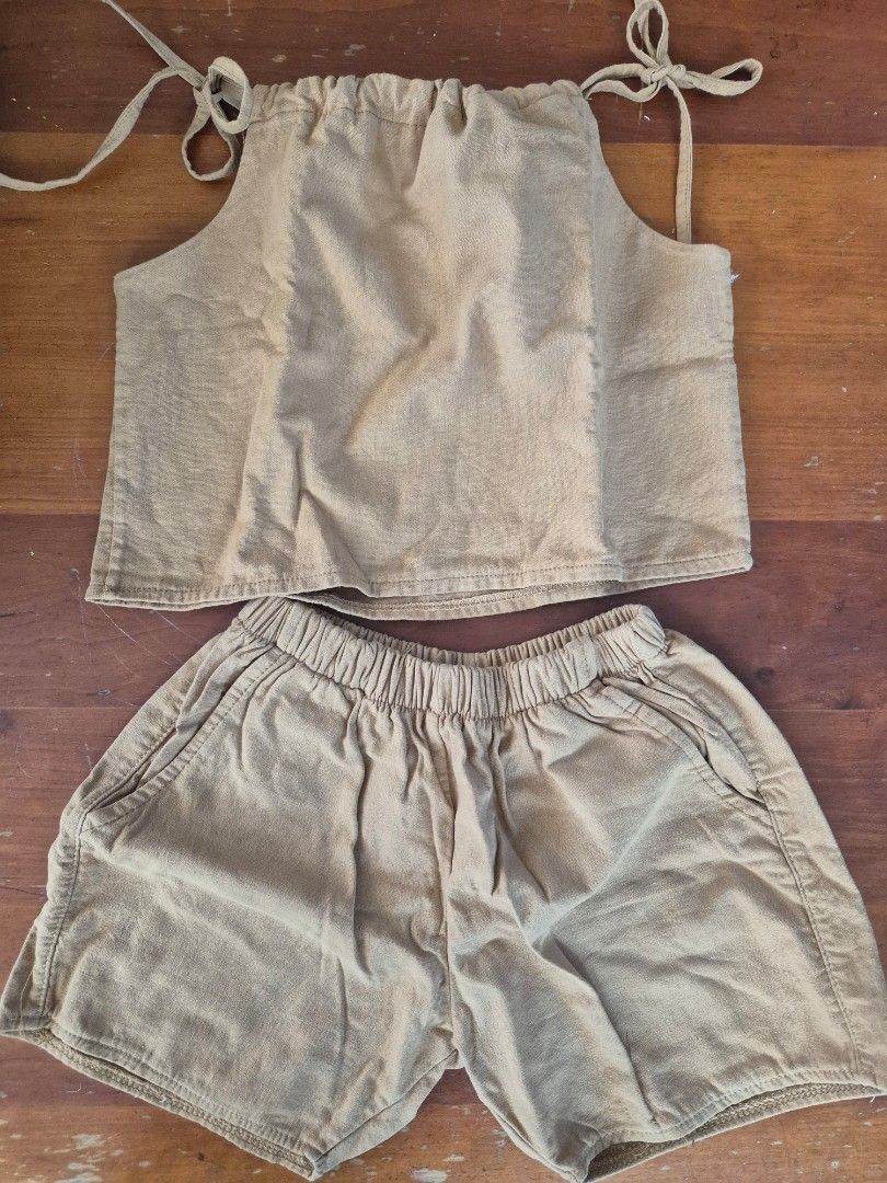 Beige two-piece crop top and shorts set (Category: Babies & Kids Fashion) located in San Jose. Submitted by nova2023 (Listing ID 1468978936, Image 2). Description: - Color: Neutral beige - Style: Matching two-piece set (crop top and shorts) - Top details: Self-tie shoulders, gathered back - Shorts details: Elastic waistband, functional pockets - Fabric: Lightweight and perfect for warm weather - Condition: Worn only a couple of times, very good s