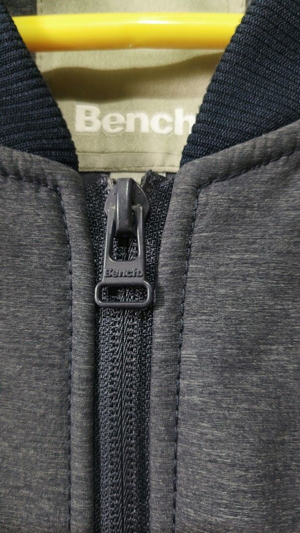 Bench Bomber Jacket Grey (Category: Coats, Jackets and Outerwear) located in Aborlan. Submitted by tonsky_thrift (Listing ID 1468970526, Image 3). Description: ‎📌 Size: Large ‎📌 Dimes: 23x 28 ‎📌 Colorate: 10/10 ‎📌 excellent condition, like new ‎📌 Issue:none - Brand: Bench - Color: Grey with dark navy ribbed cuffs, collar, and hem - Closure: Full zip with branded pull tab - Pockets: Two front slash pockets - Details: Subtle raised Bench logo 