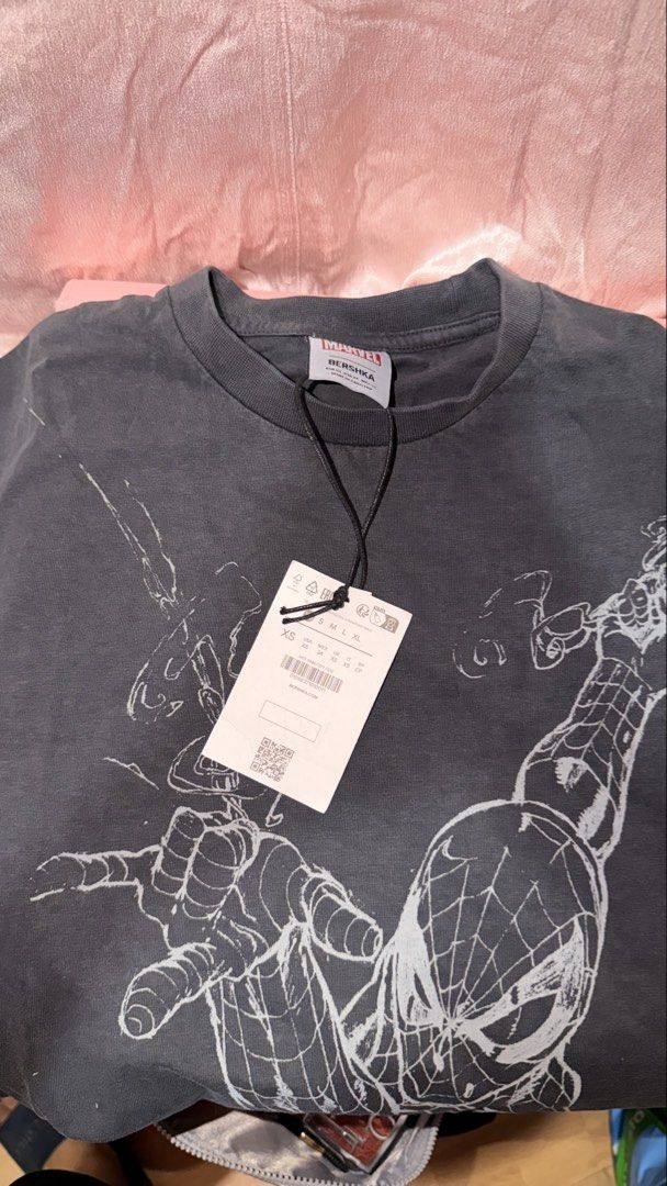 Bershka Marvel Spider-Man T-Shirt (Category: Tshirts & Polo Shirts ) located in Manila. Submitted by beeboodee (Listing ID 1469055740, Image 1). Description: - Brand: Bershka x Marvel - Design: Spider-Man graphic on front, logo lettering on back - Color: Dark grey - Details: Crew neck, short sleeves - Condition: Brand new with tags (BNWT) - Perfect for Marvel fans and casual streetwear style! - RFS: Extra - Last pic for reference when worn (I’m 1