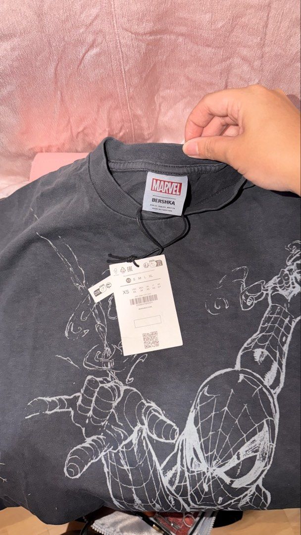Bershka Marvel Spider-Man T-Shirt (Category: Tshirts & Polo Shirts ) located in Manila. Submitted by beeboodee (Listing ID 1469055740, Image 2). Description: - Brand: Bershka x Marvel - Design: Spider-Man graphic on front, logo lettering on back - Color: Dark grey - Details: Crew neck, short sleeves - Condition: Brand new with tags (BNWT) - Perfect for Marvel fans and casual streetwear style! - RFS: Extra - Last pic for reference when worn (I’m 1