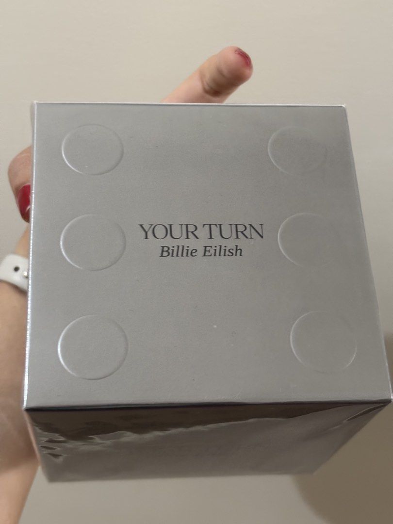 Billie Eilish Your Turn Eau De Parfum 100ml (Category: Fragrance & Deodorants) located in Manila. Submitted by loureum (Listing ID 1468991078, Image 3). Description: - Authentic Billie Eilish Your Turn Eau de Parfum - Volume: 100ml - Condition: Brand new, sealed in original plastic wrap - Packaging: Silver dice-inspired textured box with bold lettering - Guaranteed untouched with original Watsons price sticker intact Sealed and brand new Reason f