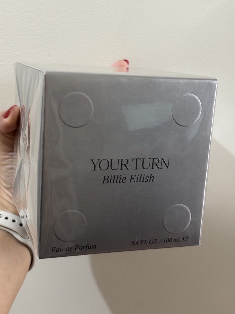 Billie Eilish Your Turn Eau De Parfum 100ml (Category: Fragrance & Deodorants) located in Manila. Submitted by loureum (Listing ID 1468991078, Image 1). Description: - Authentic Billie Eilish Your Turn Eau de Parfum - Volume: 100ml - Condition: Brand new, sealed in original plastic wrap - Packaging: Silver dice-inspired textured box with bold lettering - Guaranteed untouched with original Watsons price sticker intact Sealed and brand new Reason f