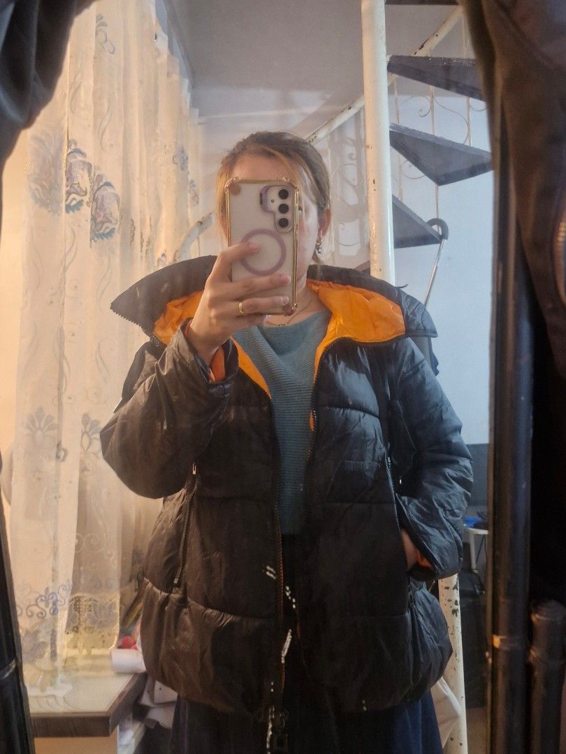 Black and Orange Puffer Jacket (Category: Coats, Jackets and Outerwear) located in Quezon City. Submitted by smrcloset (Listing ID 1469061127, Image 1). Description: - Color: Sleek black exterior with a vibrant bright orange inner lining - Warmth: Heavy padding designed to keep you cozy during cold weather - Features: Full front zip closure and convenient side pockets - Style: Trendy contrast look that stands out, perfect for winter outerwear.