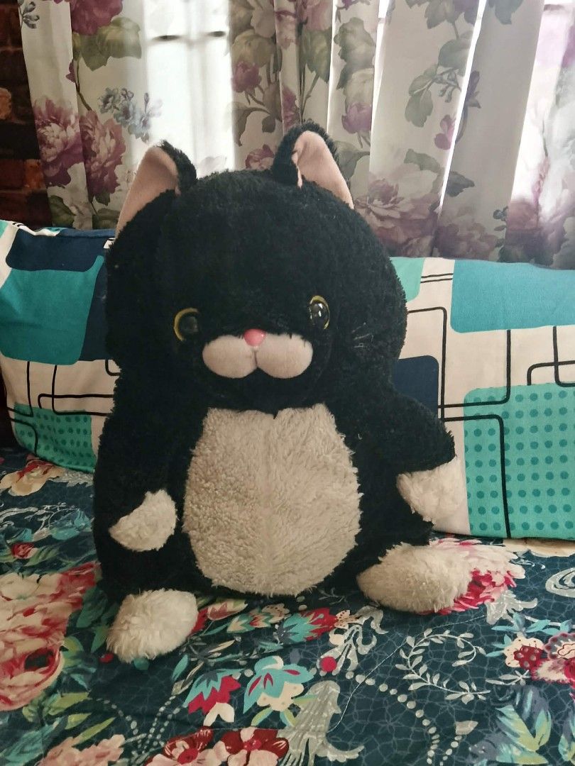 Black and White Cat Plush Toy (Category: Plushies & Soft Toys) located in Paranaque City. Submitted by b_spilner (Listing ID 1468985540, Image 1). Description: - 15 inches - Adorable black and white stuffed cat plushie - Features soft fuzzy black fur, cream belly, and white paws - Bright round yellow eyes, pink nose, and pink inner ears - Cute sitting posture, ideal for kids or plushie collectors - Stored carefully in a smoke-free home.