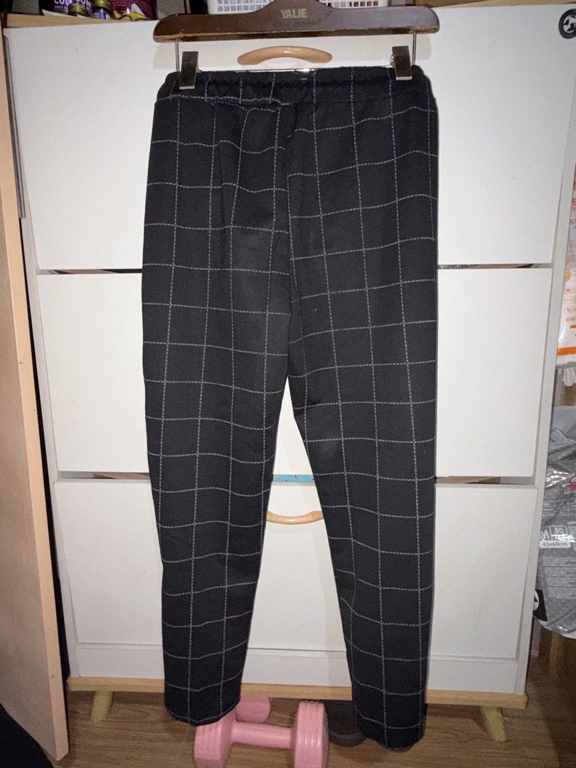 Black and White Checkered Tapered Pants Drawstring Waist (Category: Other Bottoms) located in Siquijor. Submitted by yhostuff (Listing ID 1469042428, Image 2). Description: - Color & Pattern: Black with an all-over white checkered grid - Fit: Modern tapered leg with an elastic waistband and matching black drawstring - Features: Functional front pockets and a neat pressed crease down each leg - Material: Soft, textured fabric for comfortable all-d