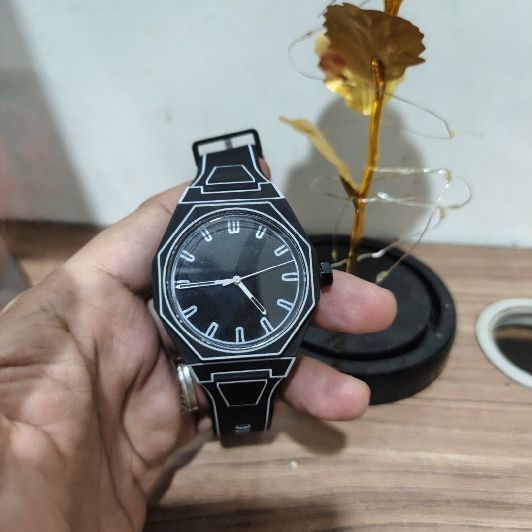 Black and White Graphic Analog Watch (Category: Women's Watches) located in Manila. Submitted by narju1234 (Listing ID 1468999287, Image 2). Description: - Casual everyday analog watch in sleek black - Eye-catching bold white outline graphics on the bezel and strap - Round black dial with minimalist white hour markers and hands - Comfortable rubber strap with a secure standard buckle clasp - Durable stainless steel case back.