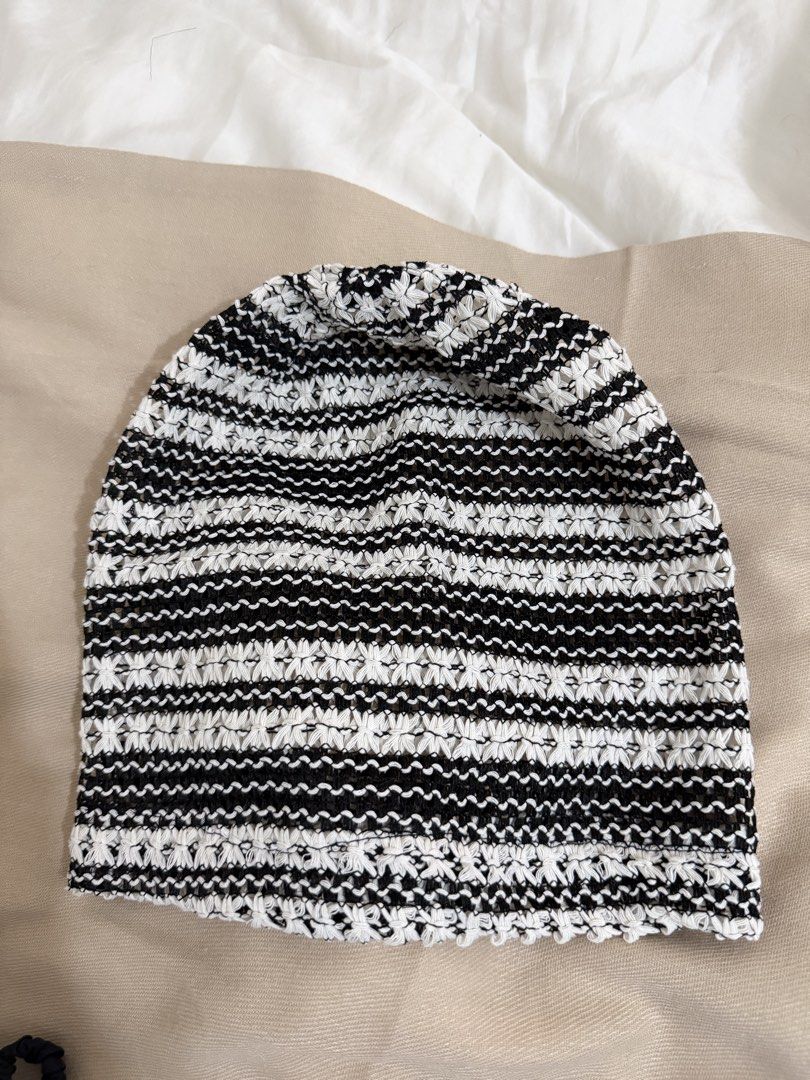 Black and White Striped Crocheted Beanie Hat (Category: Hats & Beanies) located in Taguig. Submitted by mengxir20193848 (Listing ID 1469002422, Image 2). Description: - Color: Classic black and white stripes - Design: Slouchy fit with an open-work crochet pattern - Material: Lightweight, breathable, and stretchy knit fabric - Versatility: Easy to style with any outfit - Season: Perfect everyday accessory for cooler days.