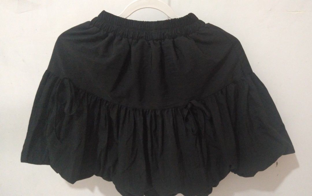 Black bubble skirt tiered ruffled mini skirt (Category: Skirts) located in Marikina City. Submitted by newowners2025 (Listing ID 1468950550, Image 3). Description: Size: Small - Medium Length: 17 in Waist: 24-38 in (garterized) Style: Y2K black bubble mini skirt Fit: Comfortable elastic waistband for an easy fit Fabric: Lightweight with plenty of volume and flare Pairing: Perfect to match with basic crop tops or baby tees With built-in shorts. no