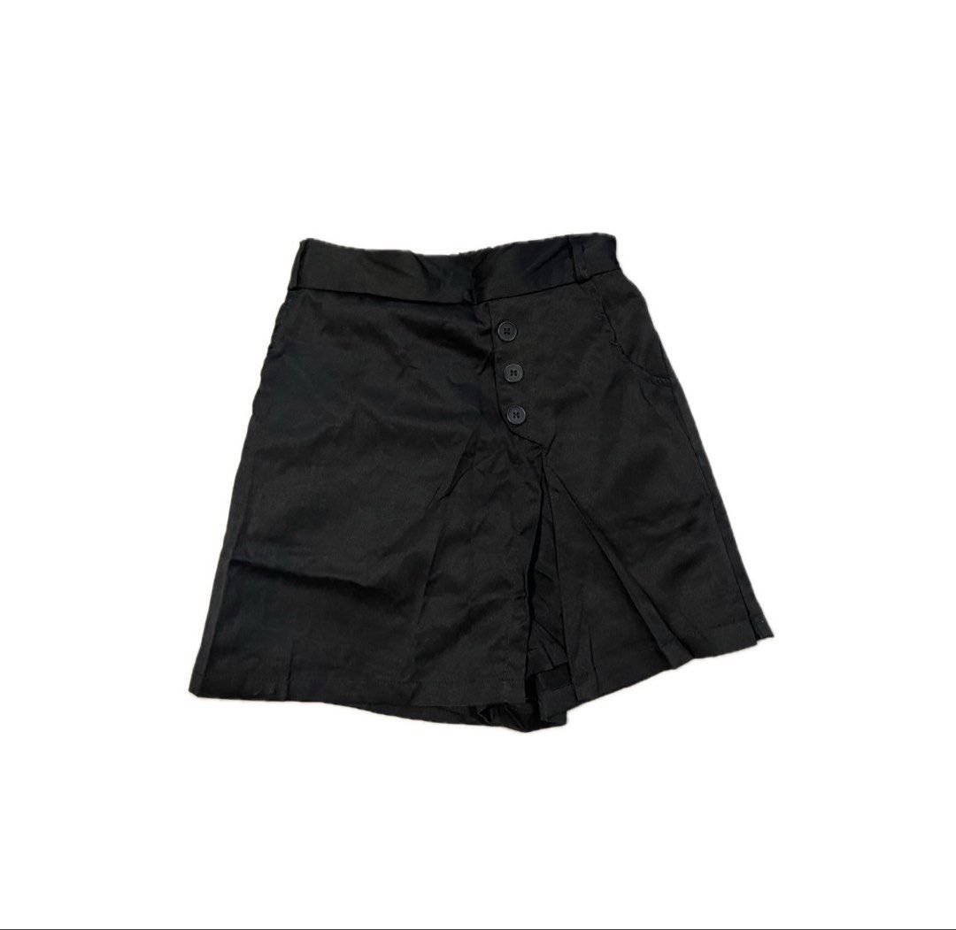 Black button front wrap skort shorts (Category: Skirts) located in Koronadal. Submitted by keenpenguin_6af0c6 (Listing ID 1468990298, Image 1). Description: - Style: High-waist black skort with wrapped front panel - Design: Chic diagonal three-button detail on the right side - Comfort: Skirt look on the front with hidden shorts underneath - Material: Smooth, high-quality fabric with a structured waistband - Mode of Payment: GCash, BPI, or Bank Tr