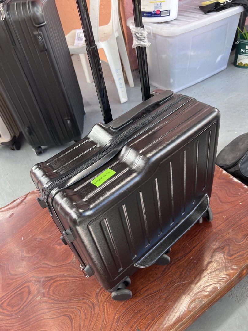 Black Carry-On Hard Shell Rolling Luggage Suitcase (Category: Luggage) located in Rizal. Submitted by imallari88 (Listing ID 1469019928, Image 1). Description: - Color: Black hard-shell exterior - Size: Measures 18 inches across (ideal cabin baggage / pakicheck nalang images ) -2-in-1 Design: Combines a travel suitcase with a fun ride-on experience for kids. -Parent-Guided Travel: Features an extendable handle that parents can use to guide or pul