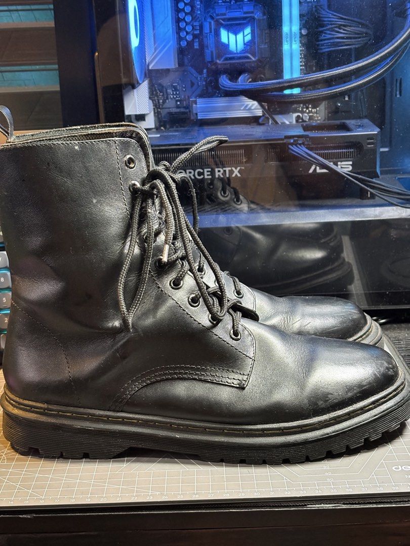 Black combat boots lace up chunky lug sole (Category: Boots) located in Manila. Submitted by rcbln (Listing ID 1469156745, Image 2). Description: - Style: Classic utilitarian black combat boots with a chunky heel - Features: Lace-up front with metal eyelets and back pull tabs for easy wear - Material: Leather upper with visible creasing and scuffs on the toes from regular use - Soles: Thick, solid lug soles with plenty of traction left - Conditio