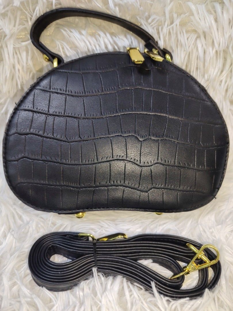 Black Crocodile Texture Cat Charm Handbag with Strap (Category: Cross-body Bags) located in Quezon City. Submitted by zhelcloset01 (Listing ID 1469064575, Image 2). Description: - Color: Black with luxury faux crocodile texture - Hardware: Elegant gold-tone with secure zipper closures - Compartments: Two spacious main zipped compartments - Handles & Strap: Double top handles plus a detachable, long adjustable shoulder strap - Extra Details: Inclu