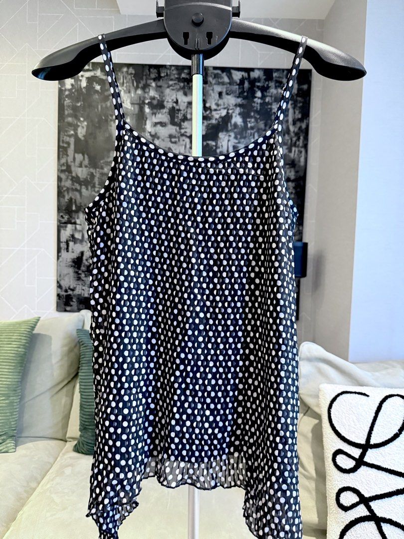 Black Fully Pleated chiffon layered cami polka top (Category: Sleeveless) located in Taguig. Submitted by annebydesign (Listing ID 1469043474, Image 2). Description: Hi all. Selling this Black Fully Pleated chiffon layered cami polka top for ₱300 (Issey Miyake style of pleating) •Like new. Decluttered from the studio •Size Medium- Large (I think it will fit XL) super wide due to pleated style nya •Fully pleated- long side style •Adjustable strap.