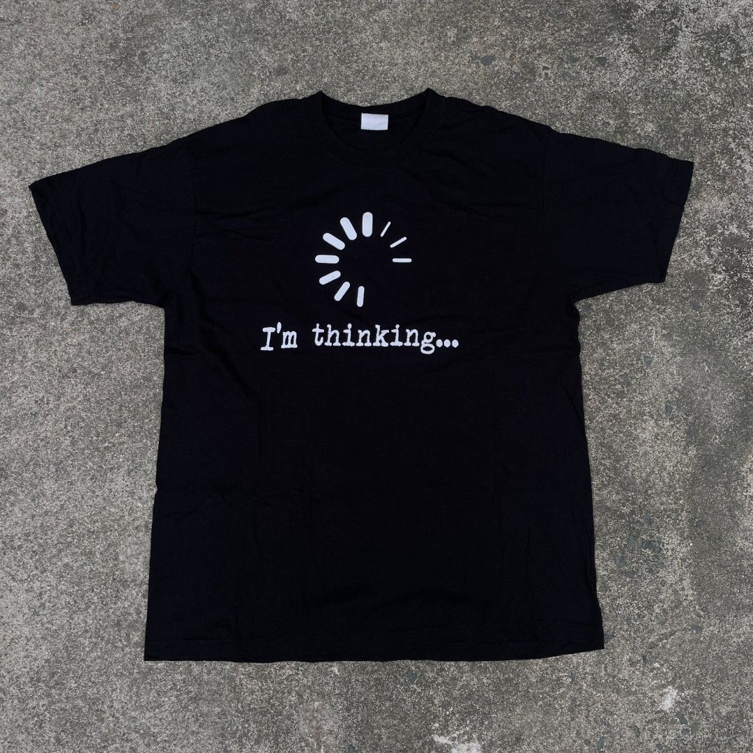 Black Graphic T-Shirt I'm Thinking Loading Wheel (Category: Tshirts & Polo Shirts ) located in Tanza. Submitted by ThriftPieces (Listing ID 1468976544, Image 1). Description: - Color: Black with white front graphic - Design: Loading wheel symbol with 'I'm thinking...' text - Fit: Casual fit with a basic round neckline - Material: Soft and breathable cotton.