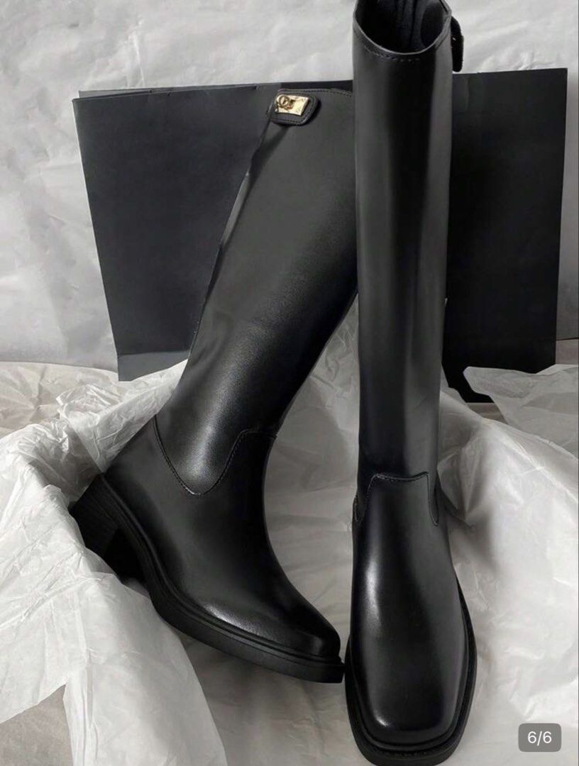 Black High Boots with Gold Lock Detail (Category: Boots) located in Manila. Submitted by arianneliz18 (Listing ID 1468956659, Image 3). Description: - Style: Knee-high boots with chunky block heels and rounded square toes - Material: Smooth black faux leather - Details: Chic gold metallic hardware lock closure near the top - Convenience: Side zipper design for easy wear - Condition: Clean soles with minimal signs of wear - Season: Great for autum