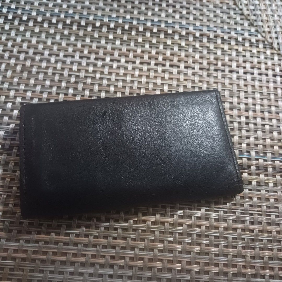 Black leather key case holder (Category: Wallets & Card holders) located in Manila. Submitted by borbone13335092 (Listing ID 1468930803, Image 2). Description: - Color/Material: Black leather with elegant gold-toned hardware - Closure: Secure front flap with snap button - Interior: Multiple key hooks plus a convenient split ring - Size: Compact and pocket-friendly - Condition: Clean inside and out, ready for daily use.