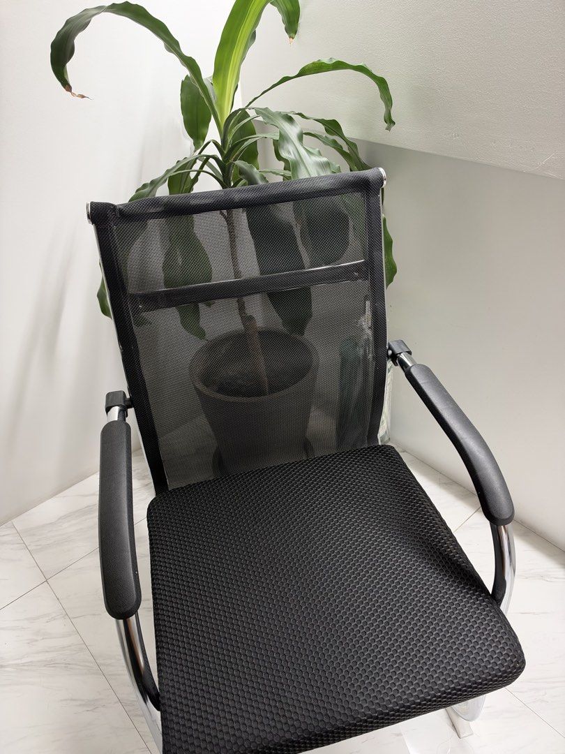 Black mesh visitor office chair (Category: Office Furniture & Fixtures) located in Manila. Submitted by michaela_heartfilia (Listing ID 1468970298, Image 1). Description: - Breathable black mesh back design keeps you cool during long hours - Comfortable cushioned seat with supportive padded armrests - Sturdy chrome cantilever frame for reliable support - Clean and modern look that matches any home or office setup - Versatile use: ideal for meetin