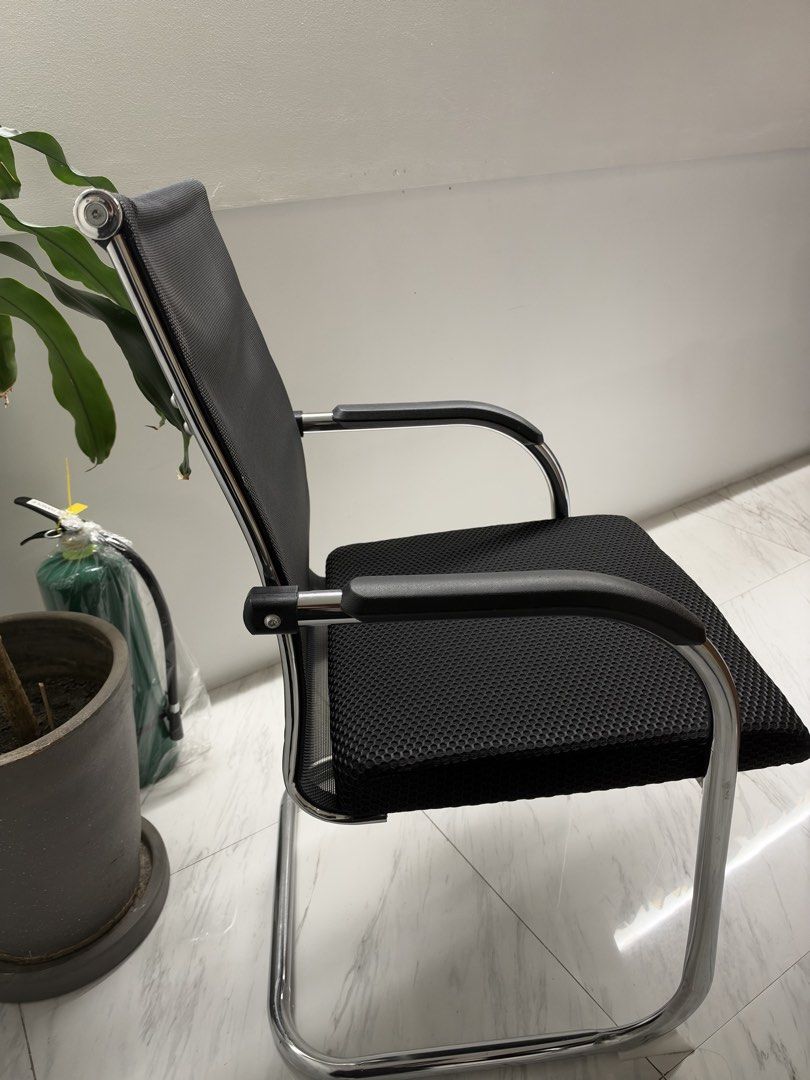 Black mesh visitor office chair (Category: Office Furniture & Fixtures) located in Manila. Submitted by michaela_heartfilia (Listing ID 1468970298, Image 2). Description: - Breathable black mesh back design keeps you cool during long hours - Comfortable cushioned seat with supportive padded armrests - Sturdy chrome cantilever frame for reliable support - Clean and modern look that matches any home or office setup - Versatile use: ideal for meetin