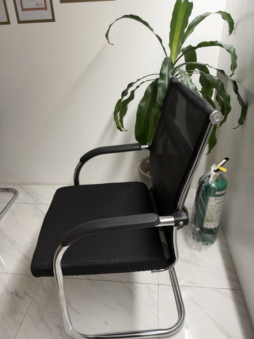 Black mesh visitor office chair (Category: Office Furniture & Fixtures) located in Manila. Submitted by michaela_heartfilia (Listing ID 1468970298, Image 3). Description: - Breathable black mesh back design keeps you cool during long hours - Comfortable cushioned seat with supportive padded armrests - Sturdy chrome cantilever frame for reliable support - Clean and modern look that matches any home or office setup - Versatile use: ideal for meetin