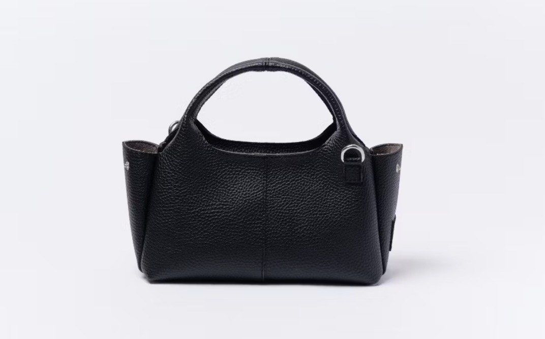 black mini leather bag with sling (Category: Tote Bags) located in Quezon City. Submitted by kalmai (Listing ID 1469026212, Image 3). Description: height 5.5" length 9"-12" width 3" - Material: Premium black pebble leather with sleek silver hardware - Versatility: Includes dual top handles and a detachable and adjustable sling - Design: Structured, compact shape perfect for everyday use - Extras: Features an adorable detachable pink key charm - C