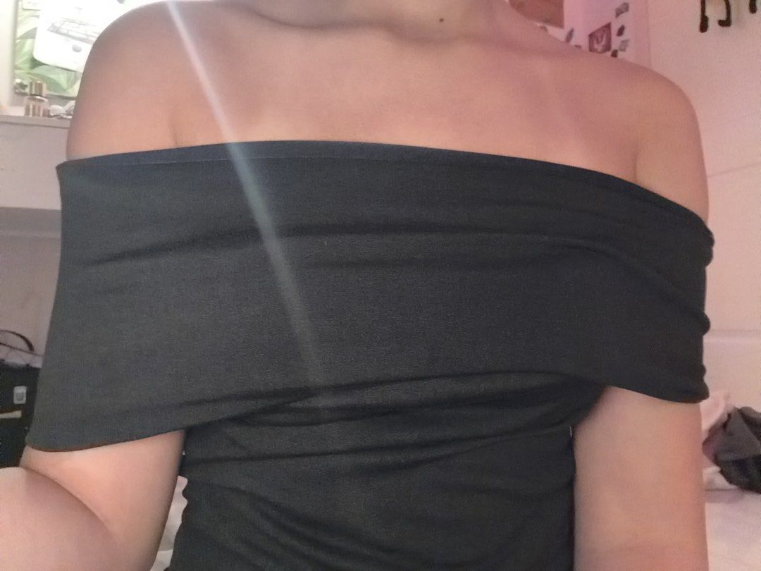 Black off-shoulder top (Category: Blouses) located in Manila. Submitted by niafatima (Listing ID 1469096907, Image 1). Description: - Color: Black - Style: Off-shoulder with fold-over collar - Fit: Snug around bust and shoulders with stretchy fabric - Condition: Clean, no tears or stains - Styling: Great with high-waisted jeans or skirts for casual nights out.