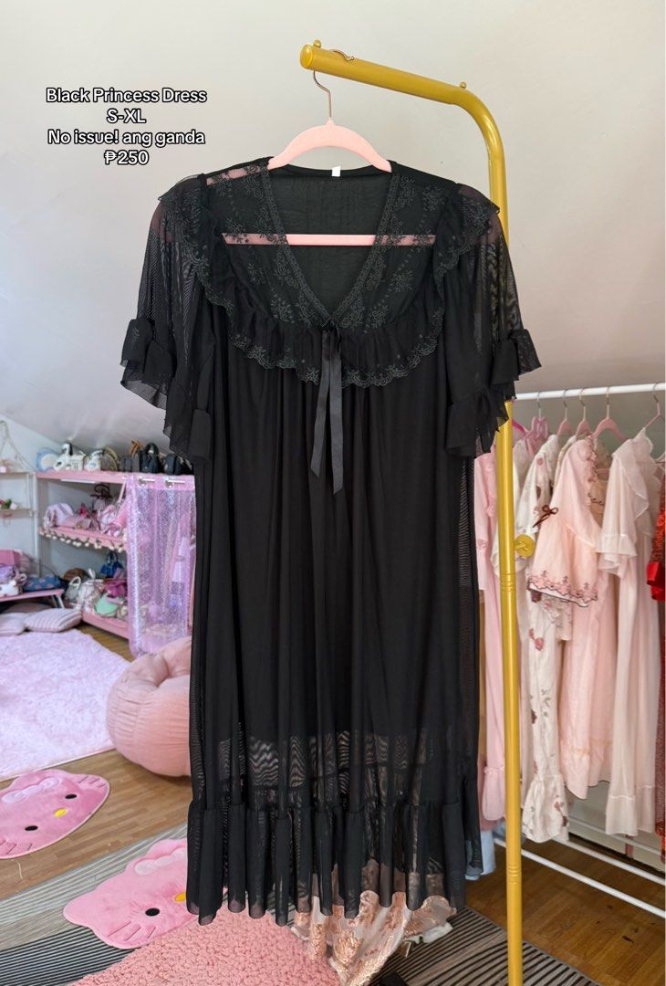 Black Princess Mesh Dress (Category: Dresses) located in Caloocan City. Submitted by fashionshop248 (Listing ID 1468952314, Image 1). Description: - Style: Black princess dress - Design: Short sleeves, ruffled lace collar, tie ribbon at the neckline, and tiered hemline - Material: Lightweight mesh - Size: Fits S to XL.