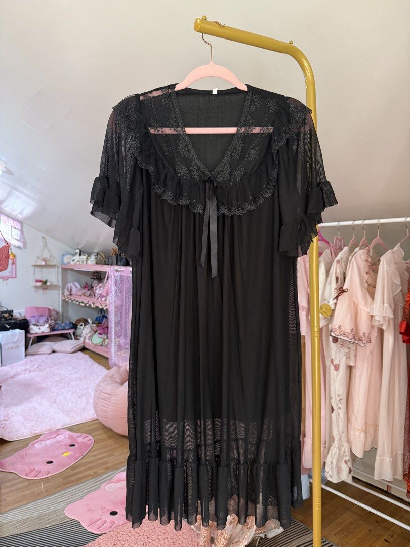 Black Princess Mesh Dress (Category: Dresses) located in Caloocan City. Submitted by fashionshop248 (Listing ID 1468952314, Image 3). Description: - Style: Black princess dress - Design: Short sleeves, ruffled lace collar, tie ribbon at the neckline, and tiered hemline - Material: Lightweight mesh - Size: Fits S to XL.