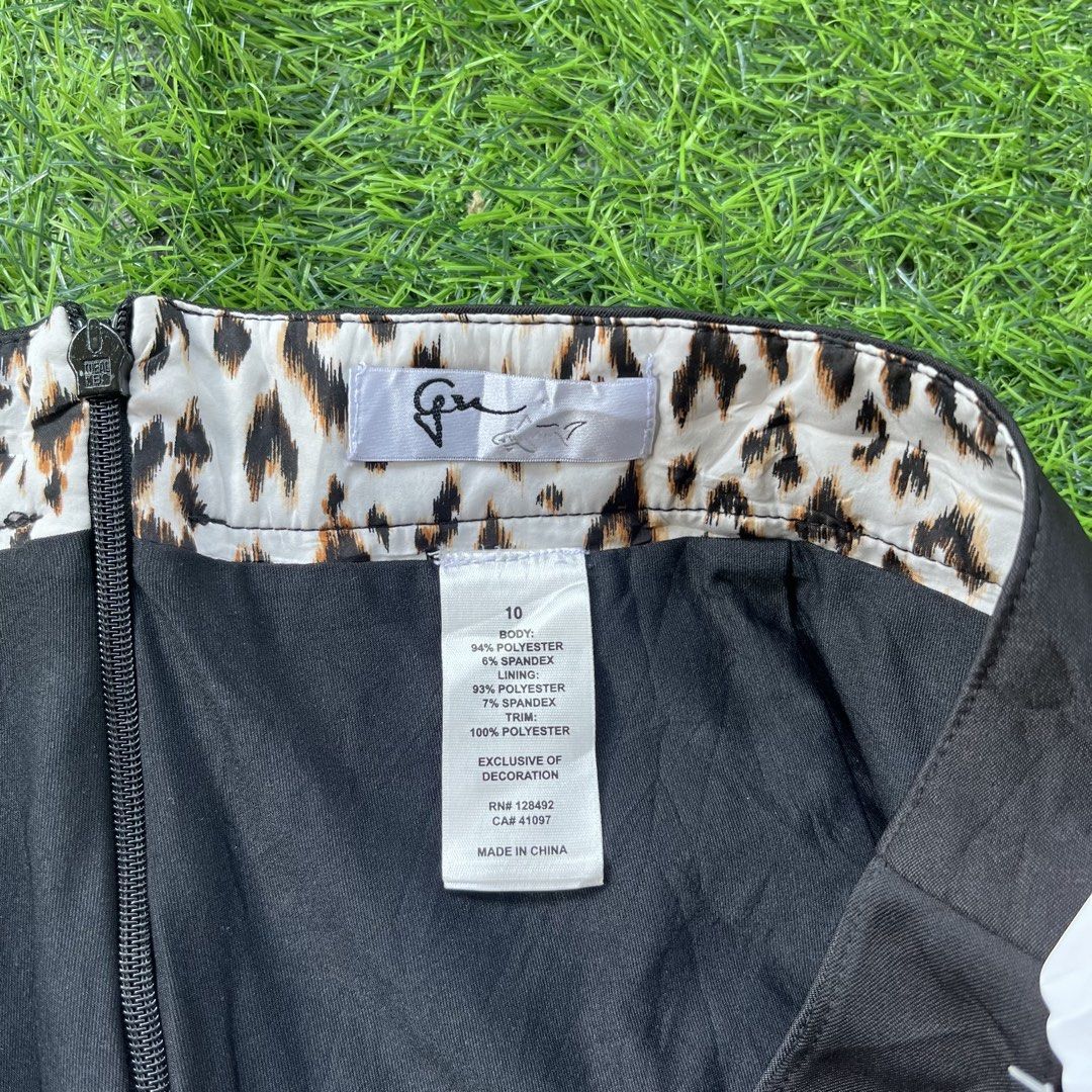 Black Skort with Built-in Shorts Size 10 (Category: Skirts) located in Cuyapo. Submitted by Ashtyn.Pre.Loved (Listing ID 1469069916, Image 2). Description: - Style: Athletic skort with built-in shorts underneath - Size: 10 - Measurements: Waist 35", Length 18" - Material: Comfortable polyester and spandex blend - Design: Classic black with stylish white piping on the sides - Details: Chic leopard print lining on the inner waistband, front button 