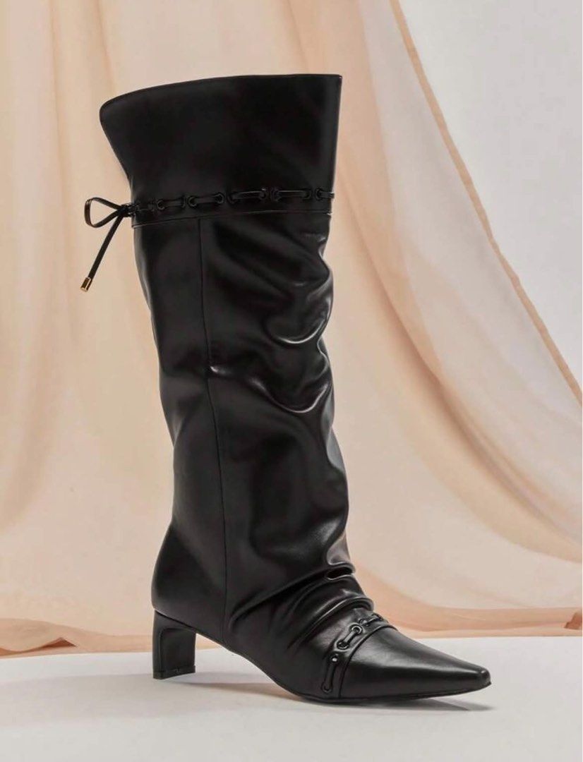 Black slouched knee-high boots with bow tie back (Category: Boots) located in Manila. Submitted by jiro066865 (Listing ID 1468949368, Image 1). Description: - Style: Slouchy knee-high boots with a chic pointed toe and pull-on design - Heel: Comfortable chunky block heel for everyday height - Details: Split back collar with thin string ribbon and metallic aglets, plus stylish stitching on toe cap and upper collar - Versatility: Great pair for skir