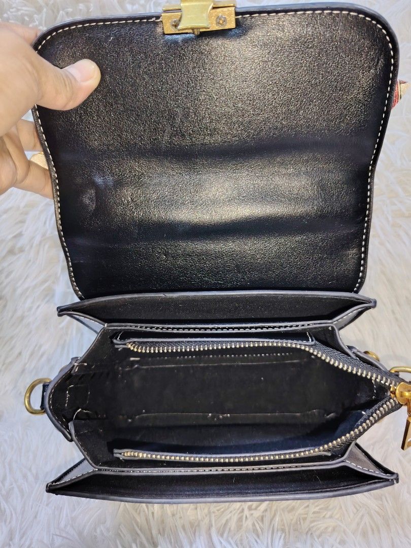 Black Structured Bag with Scarf Wrapped Handle and Studs (Category: Cross-body Bags) located in Quezon City. Submitted by zhelcloset01 (Listing ID 1469064177, Image 3). Description: - Style: Structured black handbag with gold-tone hardware - Details: Chic stud accents along the bottom edge and matching adjustable strap - Handle: Unique top handle wrapped in a colourful patterned scarf - Closure: Secure front flap with turn-lock closure - Interior