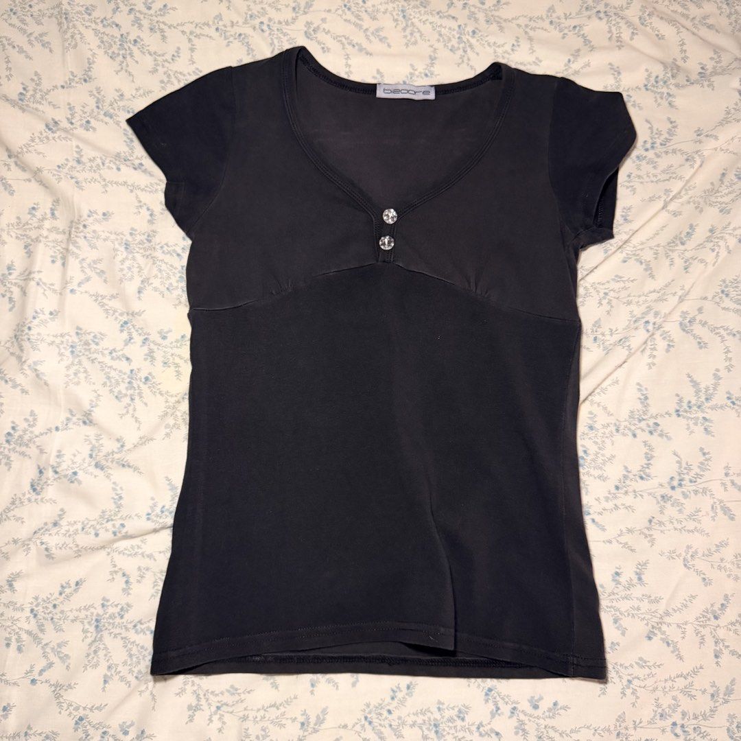 Black V-Neck Rhinestone Short Sleeve Top (Category: Shirts) located in Manila. Submitted by juliarmls (Listing ID 1469091790, Image 1). Description: No issues / flaws In really good condition Size range XS-S.