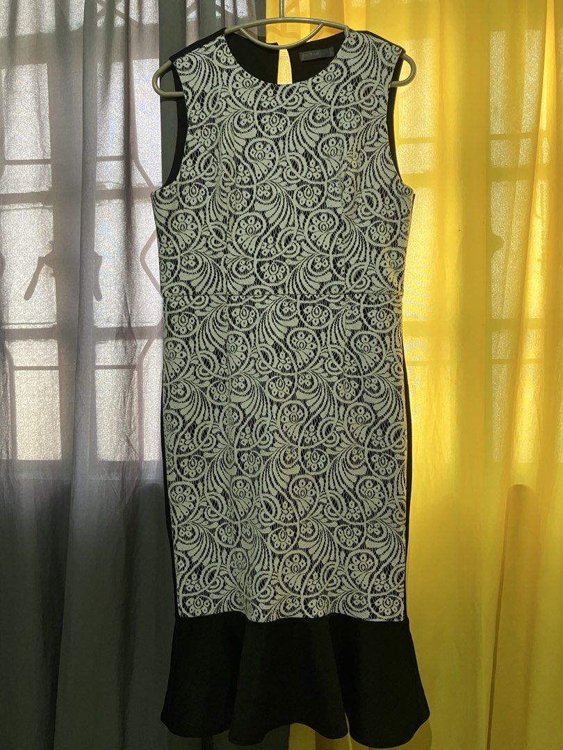 Black White Lace Dress (Category: Dresses) located in Narvacan. Submitted by liusaidh (Listing ID 1469161622, Image 1). Description: Black and white sleeveless dress from Femi 9. Detailed lace overlay pattern on the front bodice and skirt. Solid black fabric at the sides, back, and bottom ruffle hem. Round neckline with a small back keyhole cutout. Size XL tag attached near the collar. Color may vary due to lighting. .