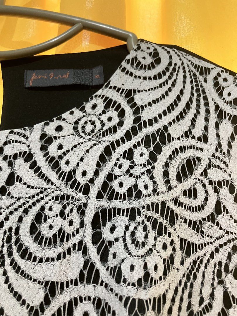 Black White Lace Dress (Category: Dresses) located in Narvacan. Submitted by liusaidh (Listing ID 1469161622, Image 2). Description: Black and white sleeveless dress from Femi 9. Detailed lace overlay pattern on the front bodice and skirt. Solid black fabric at the sides, back, and bottom ruffle hem. Round neckline with a small back keyhole cutout. Size XL tag attached near the collar. Color may vary due to lighting. .