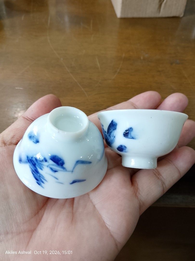 Blue and White Ceramic Tea Cups Pair (Category: Coffee & Tea Tableware) located in Baguio. Submitted by akileshomeprints (Listing ID 1468993126, Image 1). Description: - Set of 2 traditional ceramic tea cups - Elegant white base with blue hand-painted brush stroke patterns - Smooth and glossy finish for a comfortable grip - Clean condition, well-maintained - Compact size, perfectly fits in the palm of your hand 5cm diameter, 2 cm height.