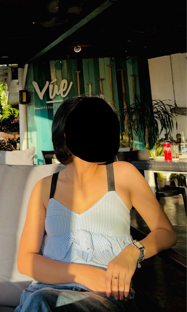 Blue and white striped ruffle camisole top (Category: Sleeveless) located in Cebu City. Submitted by swift.allyn (Listing ID 1469012634, Image 2). Description: Blue and white pinstripe camisole. Sweetheart neckline with black straps. Layered ruffle detail across the front. Cropped fit, pairs easily with high-waisted denim jeans. Lightweight fabric for warm weather outings. Worn a couple of times, still in great shape..