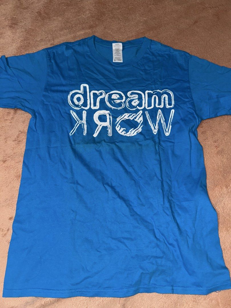 Blue Dream Work T-Shirt Size M (Category: Tshirts & Polo Shirts ) located in Manila. Submitted by prelovedbyanavi (Listing ID 1468960760, Image 1). Description: - Color: Bright blue - Design: Large white 'dream work' graphic print - Fit: Standard fit / Regular style - Size: Medium - Material: Comfortable regular cotton - Neckline: Classic crew neck.