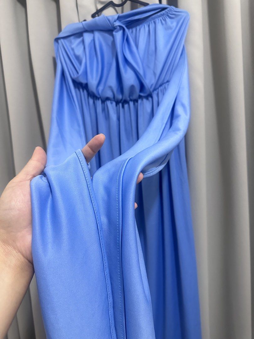 Blue infinity maxi dress (Category: Dresses) located in Quezon City. Submitted by mananglinette (Listing ID 1468988536, Image 3). Description: - Color: blue - Style: Multi-way maxi dress / infinity dress - Neckline: Strapless with gathered elastic bust - Features: Long waist ties for wrapping multiple ways to create different styles - Length: Flowy maxi length with clean stitched hems - Fabric: Smooth, soft, and stretchy for comfortable wear.