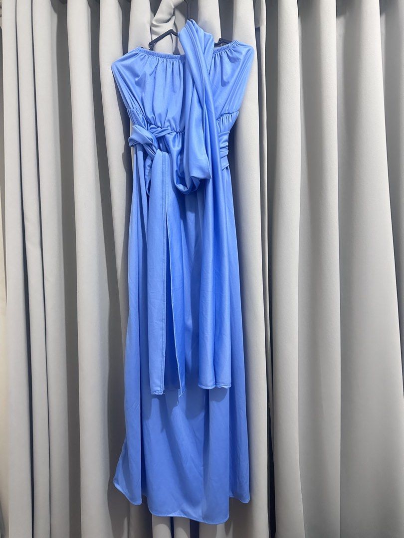 Blue infinity maxi dress (Category: Dresses) located in Quezon City. Submitted by mananglinette (Listing ID 1468988536, Image 1). Description: - Color: blue - Style: Multi-way maxi dress / infinity dress - Neckline: Strapless with gathered elastic bust - Features: Long waist ties for wrapping multiple ways to create different styles - Length: Flowy maxi length with clean stitched hems - Fabric: Smooth, soft, and stretchy for comfortable wear.