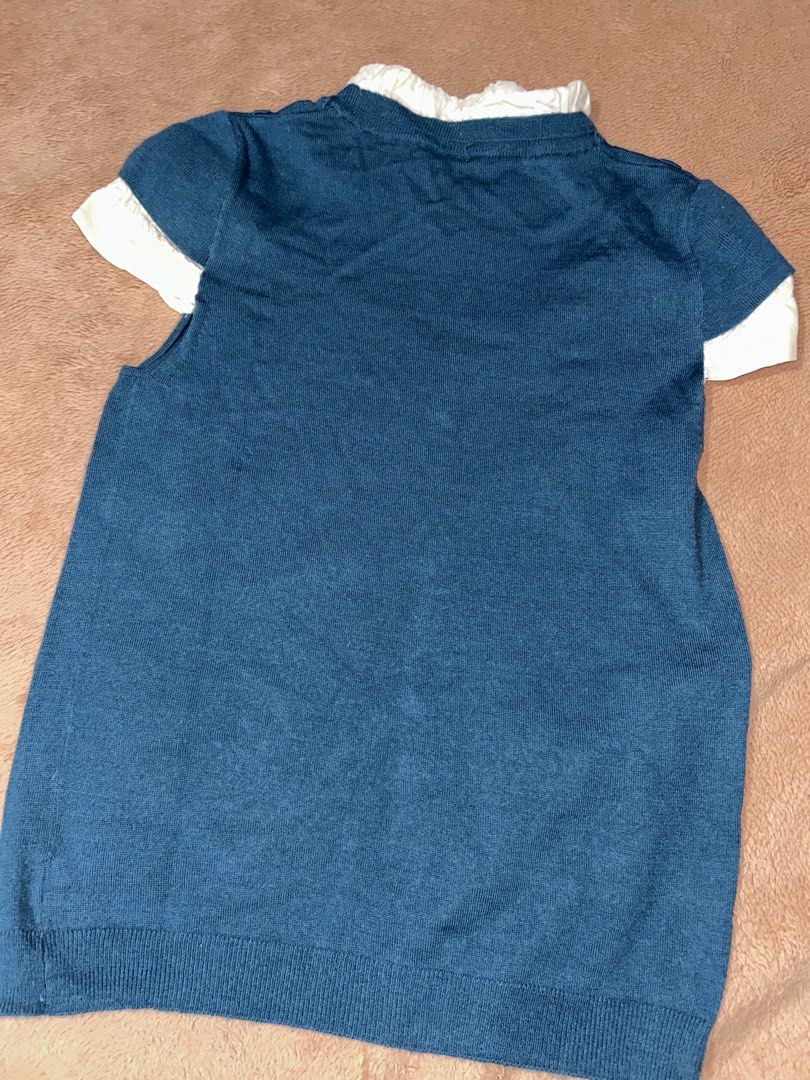 Blue Knit Sweater With White Layered Collared Top (Category: Coats, Jackets and Outerwear) located in Manila. Submitted by prelovedbyanavi (Listing ID 1468961002, Image 2). Description: - Style: Mock two-piece blue knit sweater with built-in white layered collar and sleeve cuffs - Design: Features decorative front pockets and stylish silver-toned buttons - Material: Soft knit fabric with a ribbed hem and neckline for extra comfort - Versatility: 