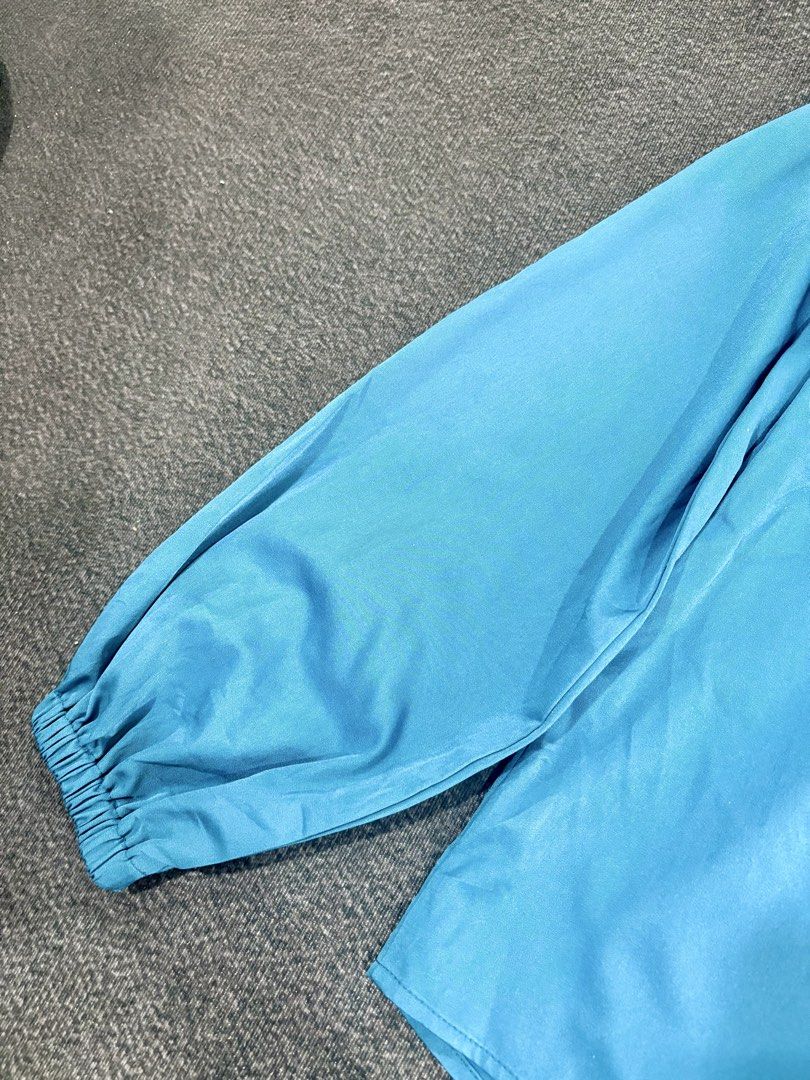 Blue Off-Shoulder Long Sleeve Top (Category: Longsleeves) located in Quezon City. Submitted by fast.closetfinds (Listing ID 1469016462, Image 3). Description: - Color: Bright blue - Style: Off-shoulder with long balloon sleeves - Comfort: Super comfy with elastic neckline and cuffs - Versatility: Easy to pair with jeans or a skirt - Condition: Excellent / Like new - Perfect for: Casual day outs, dates, or weekend errands.