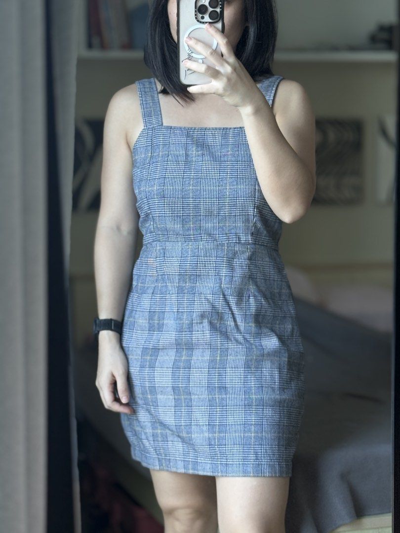 Blue Plaid Checkered Square Neck Bodycon Mini Dress (Category: Dresses) located in Pasig City. Submitted by laagn.ph (Listing ID 1469089784, Image 3). Description: - Style: Blue plaid mini dress with white, blue, and subtle yellow grid lines - Design: Square neckline, thick straps, fitted bodice, defined waistline, and straight hem (above the knee) - Closure: Hidden back zip - Material: Structured cotton-blend fabric - Occasion: Great for casual 
