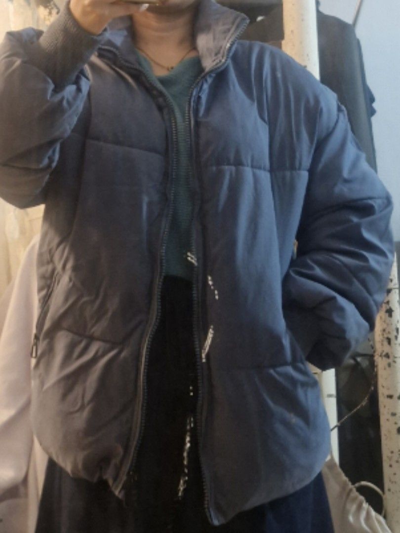 Blue Puffer Jacket Winter Coat (Category: Coats, Jackets and Outerwear) located in Quezon City. Submitted by smrcloset (Listing ID 1469061974, Image 3). Description: - Color: Solid blue - Design: Cozy quilted style with thick padding for winter - Features: High collar and secure zipped pockets on both sides - Details: Zip-up front and ribbed cuffs to keep the cold out.
