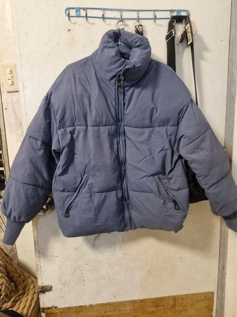 Blue Puffer Jacket Winter Coat (Category: Coats, Jackets and Outerwear) located in Quezon City. Submitted by smrcloset (Listing ID 1469061974, Image 1). Description: - Color: Solid blue - Design: Cozy quilted style with thick padding for winter - Features: High collar and secure zipped pockets on both sides - Details: Zip-up front and ribbed cuffs to keep the cold out.