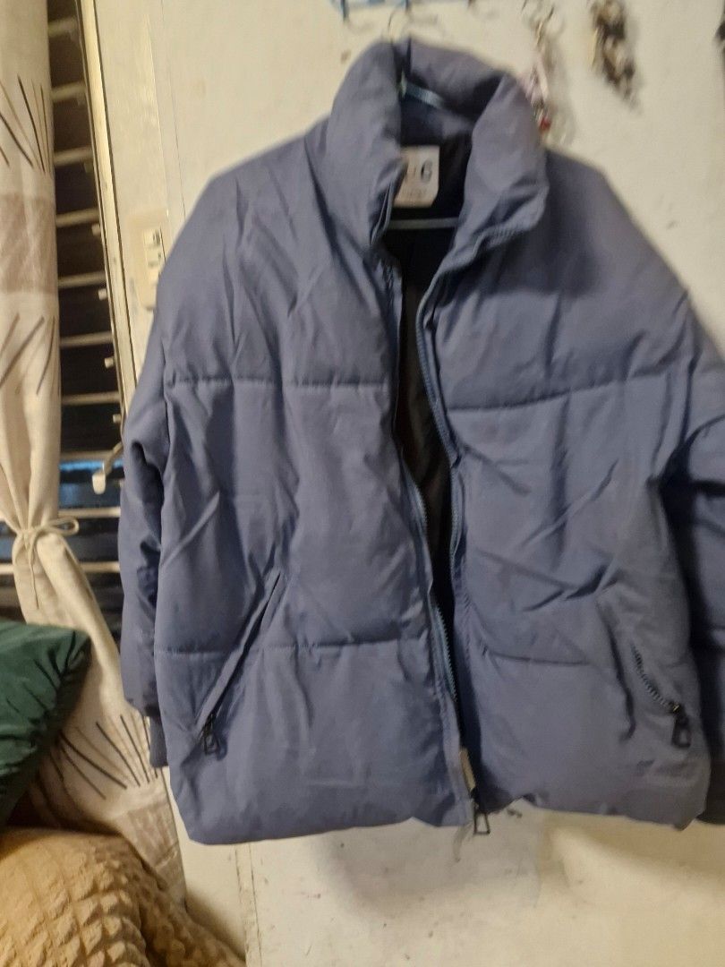 Blue Puffer Jacket Winter Coat (Category: Coats, Jackets and Outerwear) located in Quezon City. Submitted by smrcloset (Listing ID 1469061974, Image 2). Description: - Color: Solid blue - Design: Cozy quilted style with thick padding for winter - Features: High collar and secure zipped pockets on both sides - Details: Zip-up front and ribbed cuffs to keep the cold out.