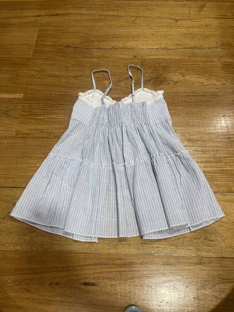 Blue Striped Top with Flyaway Front Split (Category: Sleeveless) located in Quezon City. Submitted by andreaa20 (Listing ID 1469107846, Image 2). Description: •never used, good as new •with flyaway front split •measurements in photos •free size but fits small-medium Rfs: decluttering.