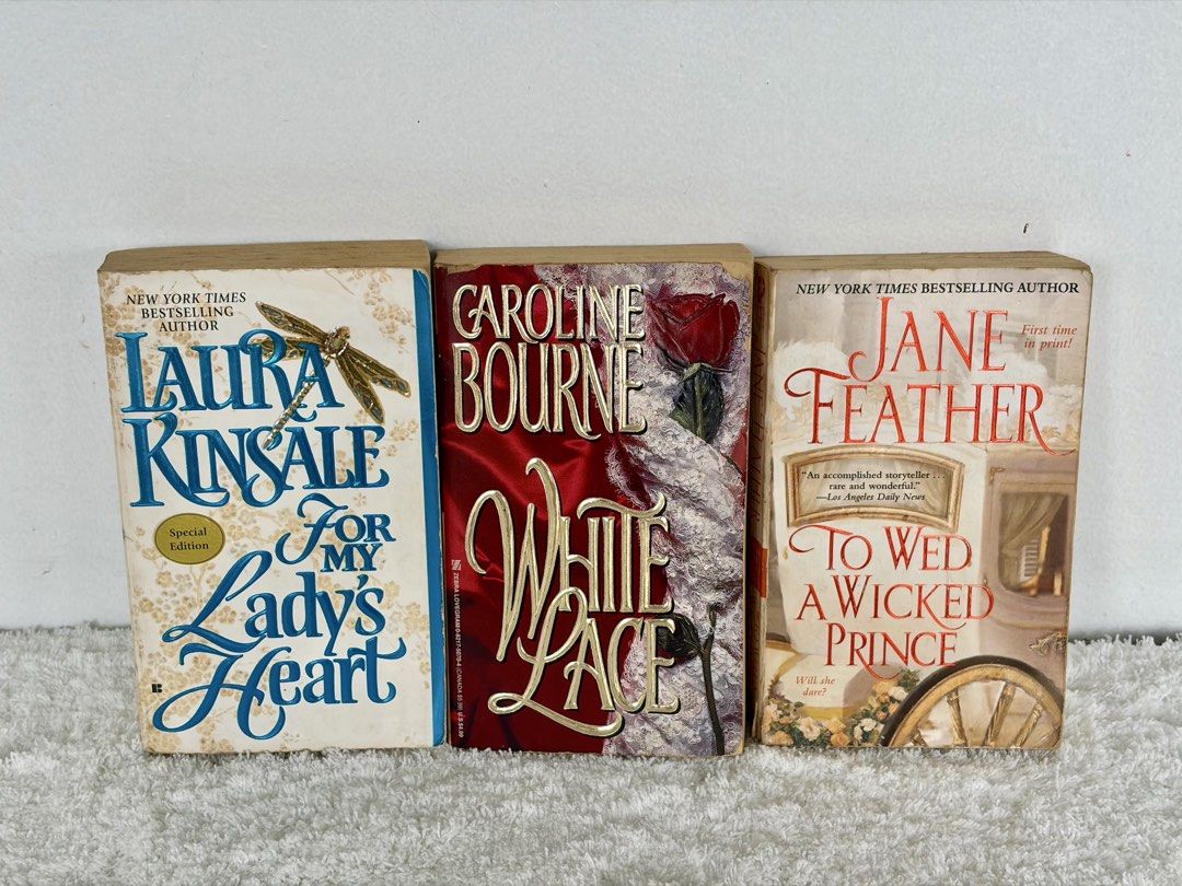 Bodice Ripper Book Bundle of 3 (Category: Storybooks) located in Naga. Submitted by klutzdeclutters (Listing ID 1468936122, Image 1). Description: Includes: - For My Lady’s Heart by Laura Kinsale - White Lace by Caroline Bourne - To Wed a Wicked Prince by Jane Feather Condition: - Covers and spines are of excellent condition. Minimal shelf wear or faint edge creasing. - Pages are clean, crisp, fully legible, and intact. No missing pages or dog-ea
