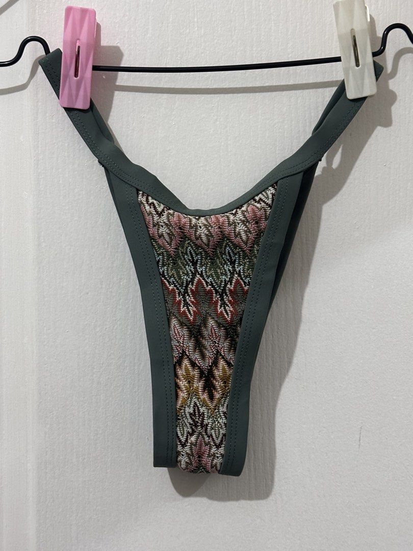 Bohemian bikini set (Category: Bikinis & Swimsuits) located in Pasig City. Submitted by prelovedbysco (Listing ID 1469036424, Image 3). Description: - Style: Knit triangle bikini set with chic multicolored geometric pattern and sage green trim - Fit: Super flattering with adjustable halter neck, back ties, and V-shape cheeky bottoms - Size: XS (tag attached) - Condition: Worn once for a quick beach trip, freshly washed and clean - Perfect for you