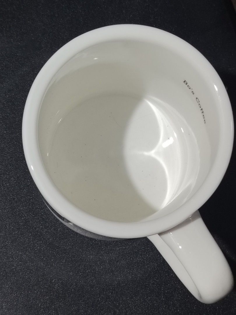 Bo's Coffee Ceramic Mug White (Category: Coffee & Tea Tableware) located in Quezon City. Submitted by epicart (Listing ID 1468975424, Image 2). Description: - Authentic Bo's Coffee ceramic mug - Classic white finish with a stylish raised black rectangular logo - Hand-made exclusively for Bo's Coffee - Sturdy build with a solid, comfortable handle - Clean interior, ready for your daily coffee or tea Medium size.