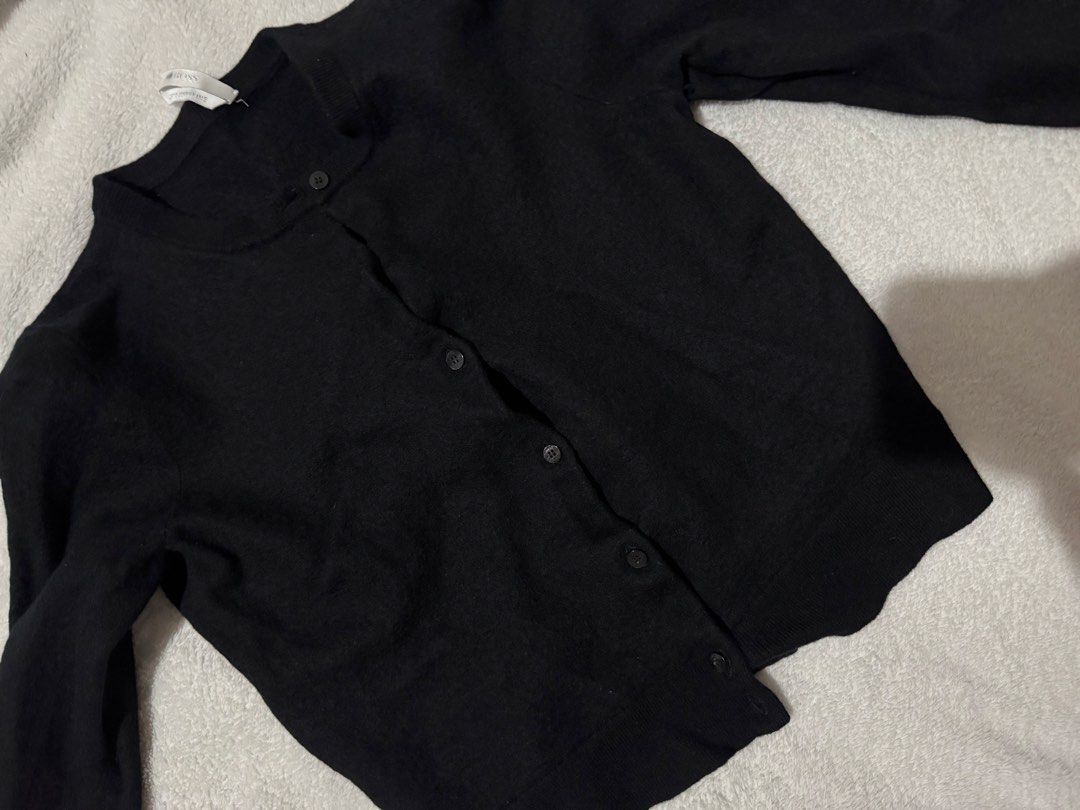 BOSS Black Knit Button-Up Cardigan (Category: Coats, Jackets and Outerwear) located in Manila. Submitted by declutter.jasmin (Listing ID 1468944753, Image 2). Description: - Brand: BOSS - Color: Classic Black - Style: Crew neck cardigan with dark front buttons - Features: Long sleeves, ribbed cuffs, and hem - Material: Soft, comfortable knit - Versatility: Easy to layer over tops or dresses; a versatile wardrobe staple.